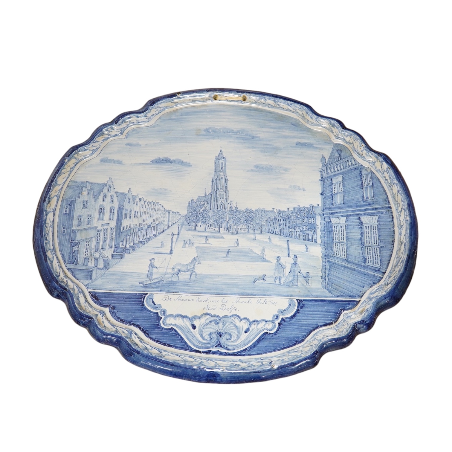 A 19th century Dutch delt shaped oval plaque, 53cm wide. Condition - fair to good